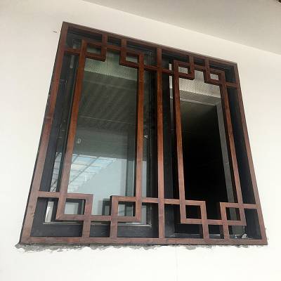仿古木纹铝窗花厂家定做 融合传统美学与现代工艺的建筑装饰选择